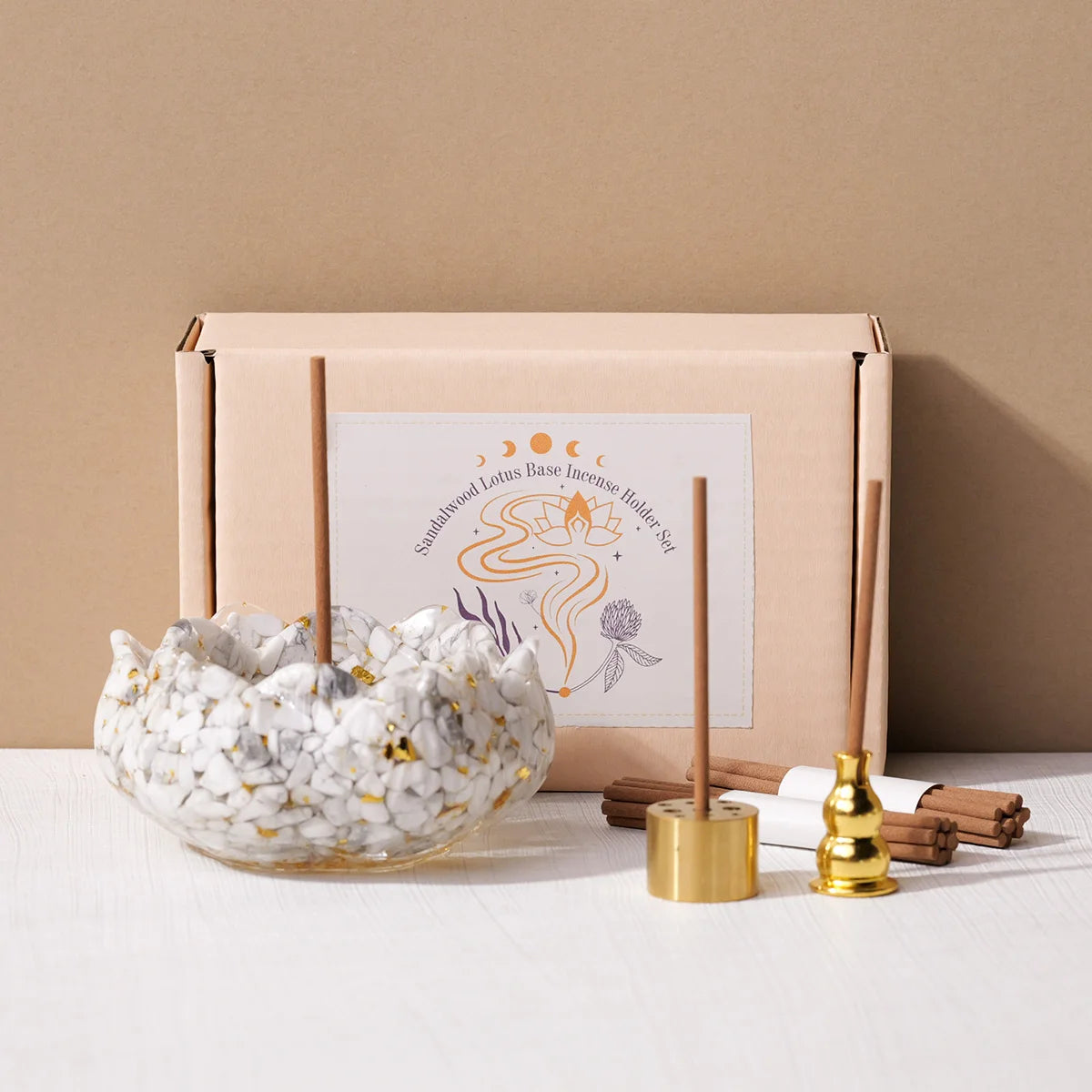 Coffret d’aromathérapie avec compte-goutte en cristal et bougie, accompagné de pierres naturelles – ambiance méditative.